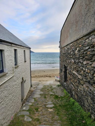 "Gorran Haven beach between two homes"